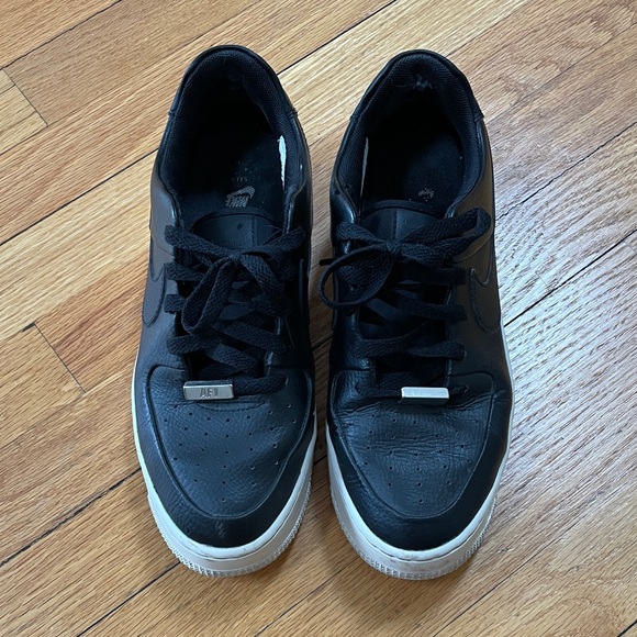Nike Shoes - Nike Black Leather Women's Low-Top Sneakers with White Soles